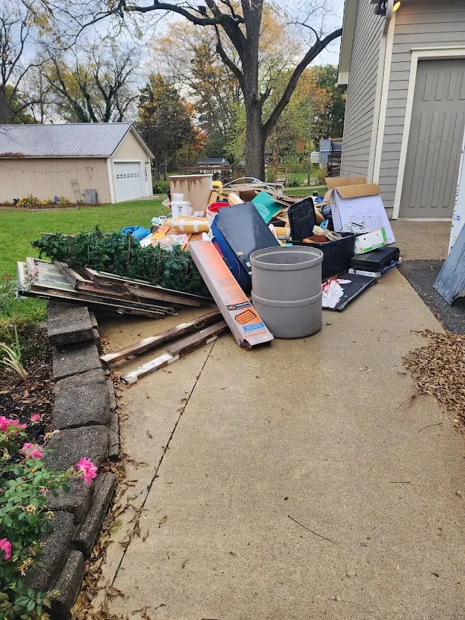 Dumpster being loaded with debris for Estate Cleanout Dumpster Rental in Port Hadlock-Irondale